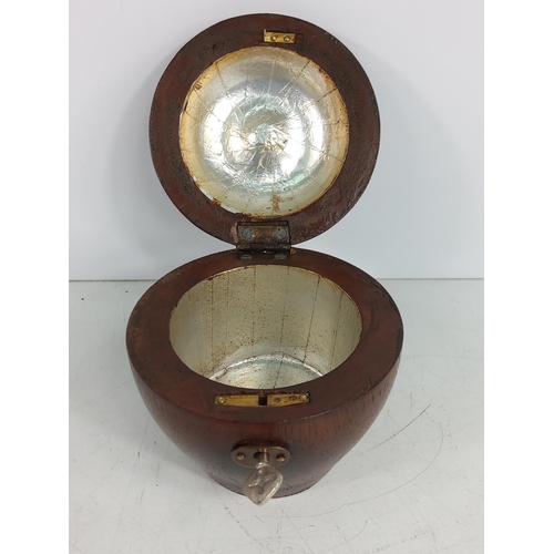 145 - Fruit wood tea caddy with key, 12cms in height, 11.5cms in diameter