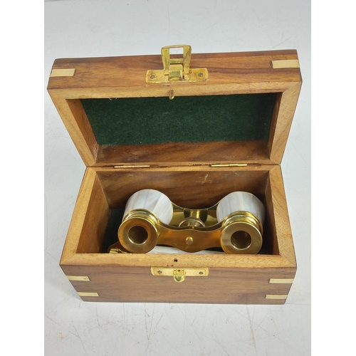 150 - Wooden cased opera glasses