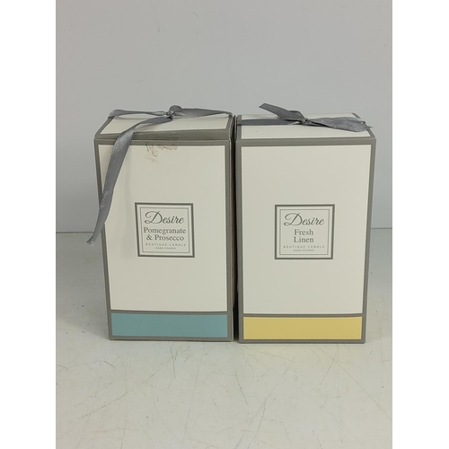 154 - 2 Boxed candles