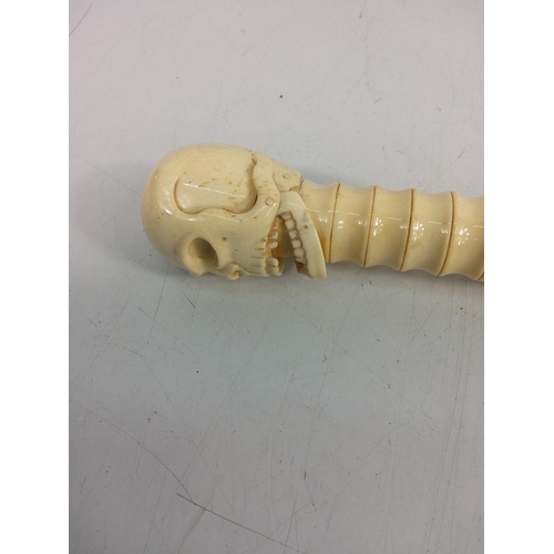 160 - Carved bone walking stick with skull top with moving jaw