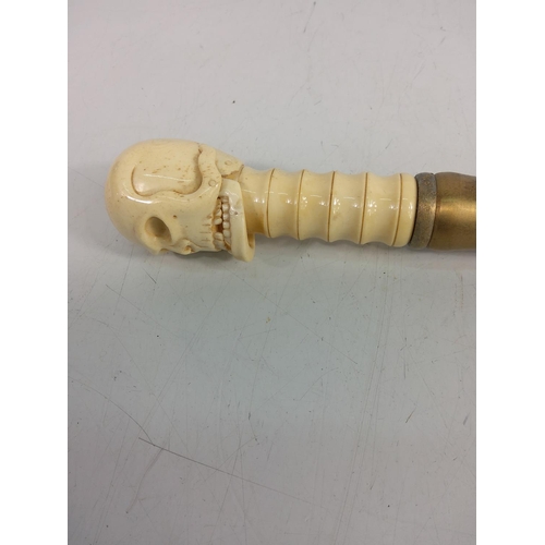 160 - Carved bone walking stick with skull top with moving jaw