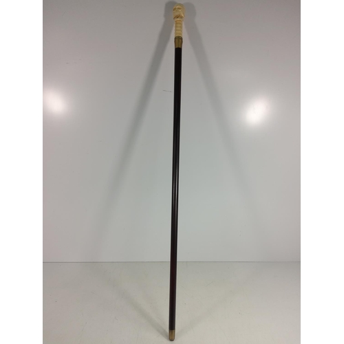 160 - Carved bone walking stick with skull top with moving jaw