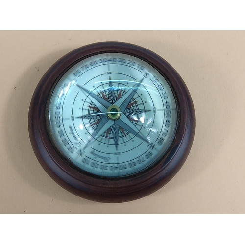 240 - Wooden mounted compass, 10cms in diameter