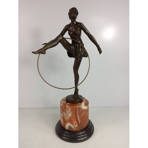 130A - Cast bronze figure of a dancing lady with hoop on marble base, 48cms in height