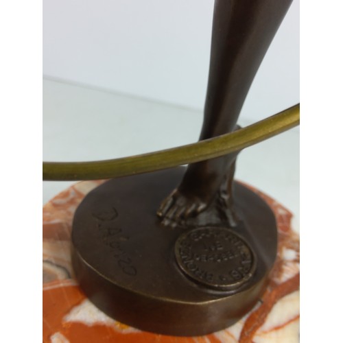 130A - Cast bronze figure of a dancing lady with hoop on marble base, 48cms in height