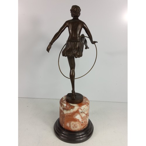 130A - Cast bronze figure of a dancing lady with hoop on marble base, 48cms in height