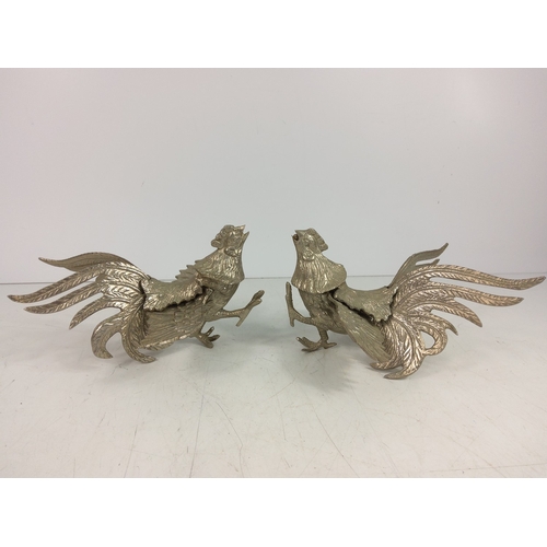 15 - Pair of cast metal fighting cockerels, 11cms in height and 19.5cms in width