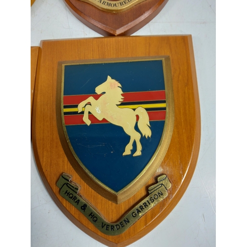 11 - 4 wooden mounted military insignia