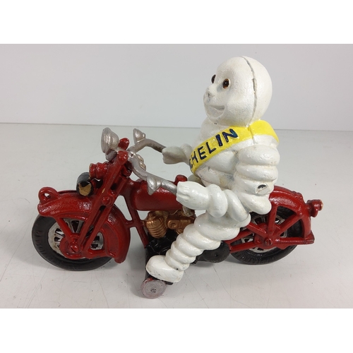 16 - Cast metal Michelin man on motorbike