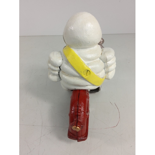 16 - Cast metal Michelin man on motorbike