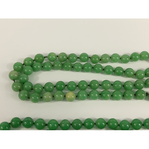 335 - 2 strings of jade green beads