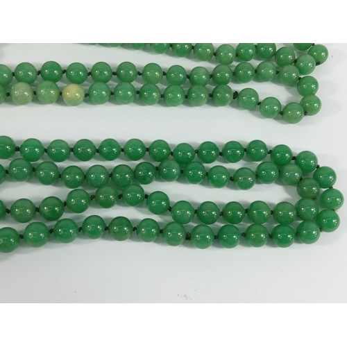 335 - 2 strings of jade green beads