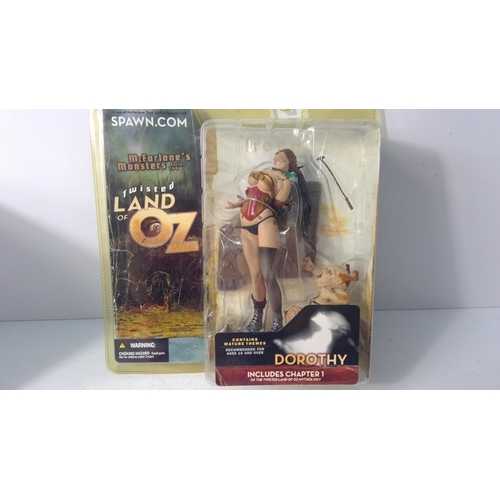 189 - Boxed Dorothy Twisted Land of Oz figurine and a model chair