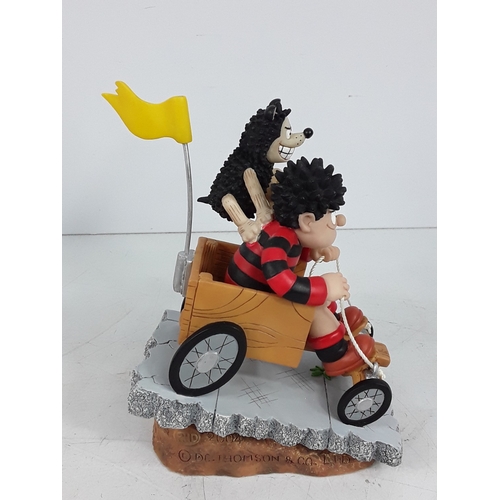 213 - One boxed Beano figure and two PG Tips