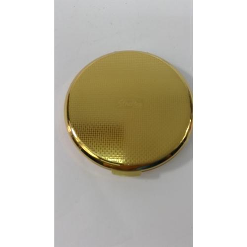 313 - An unused 1970's 21st Birthday compact and a compact with peacock design