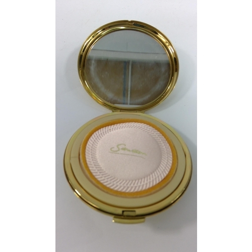 313 - An unused 1970's 21st Birthday compact and a compact with peacock design