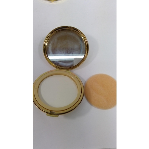 313 - An unused 1970's 21st Birthday compact and a compact with peacock design