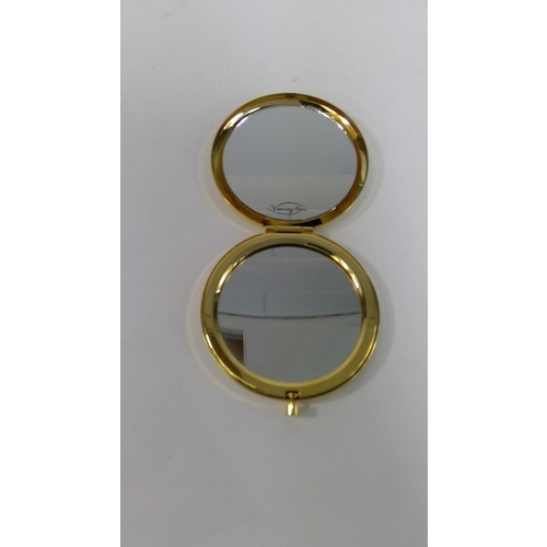 313 - An unused 1970's 21st Birthday compact and a compact with peacock design