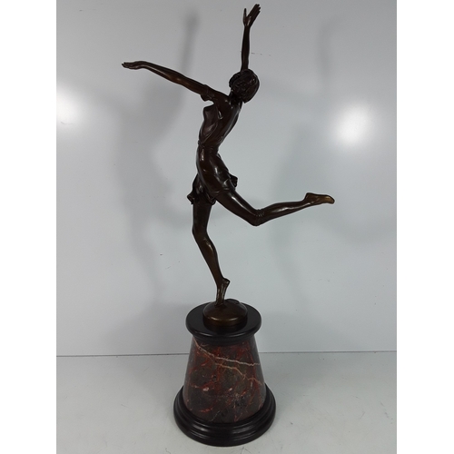 335 - Bronze dancing lady on marble base, 68cms in height