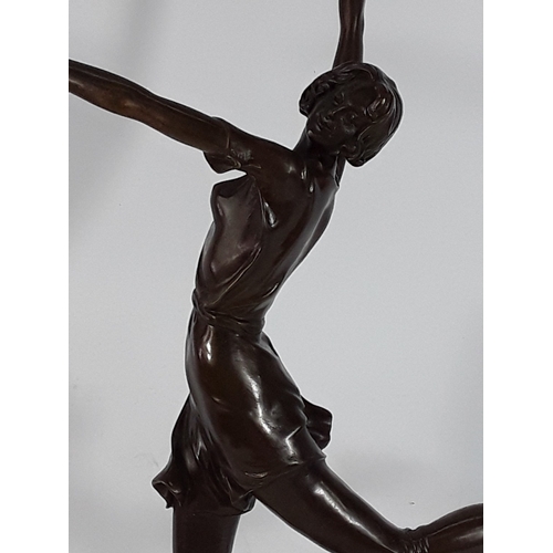 335 - Bronze dancing lady on marble base, 68cms in height