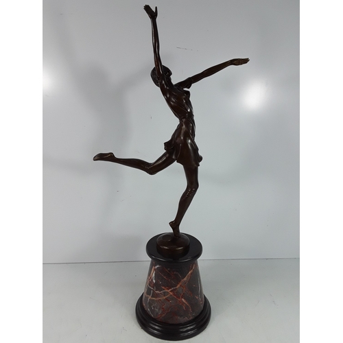 335 - Bronze dancing lady on marble base, 68cms in height