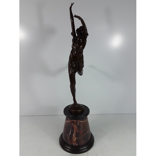 335 - Bronze dancing lady on marble base, 68cms in height