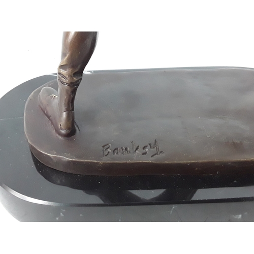 349 - Banksy style bronze on marble base - man with flowers, 25 x 22 x 12cms