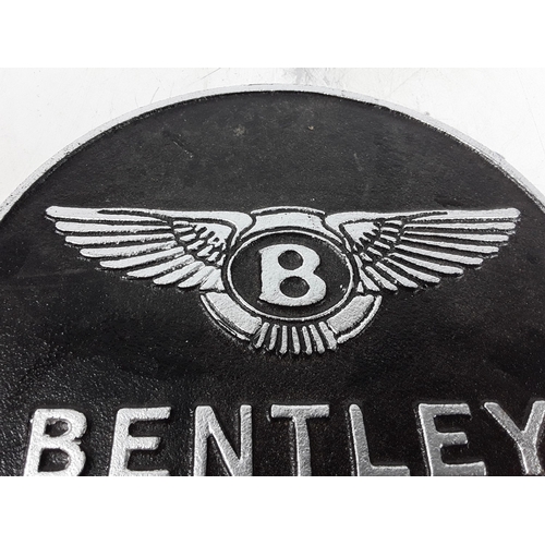 19 - Cast metal sign, 24.5cms in diameter