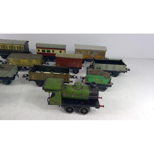 319 - Vintage metal train and various carriages and rolling stock