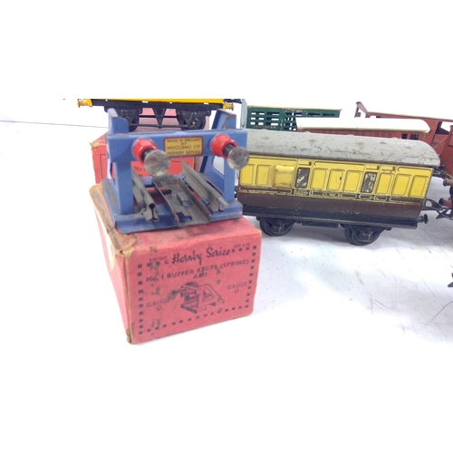 321 - Large selection of various carriages and rolling stock, mainly 0 gauge