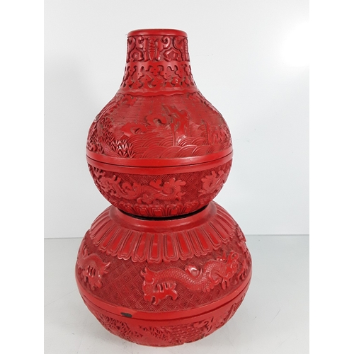 58 - Chinese cinnabar triple gourd vase, 31 x 20cms