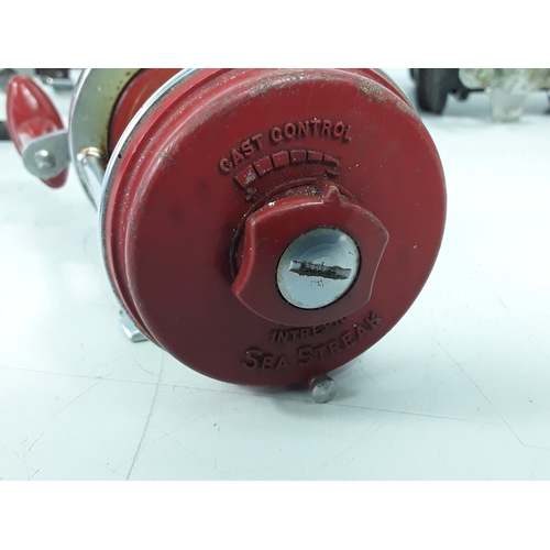 141 - Seven fishing reels, including Daiwa and Tatler