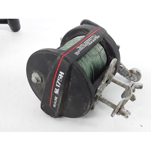141 - Seven fishing reels, including Daiwa and Tatler