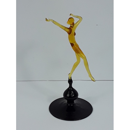 158 - Art glass dancing lady on dark glass base - probably Murano, 15cms in height