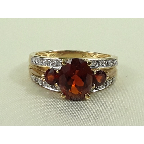 162 - 9ct gold garnet and diamond ring - Size O