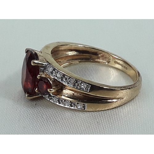 162 - 9ct gold garnet and diamond ring - Size O