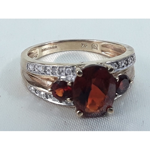 162 - 9ct gold garnet and diamond ring - Size O