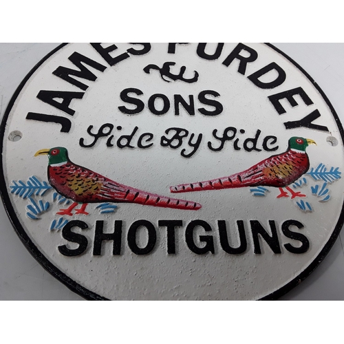 40 - Cast metal James Purdey advertising sign, 24cms in diameter