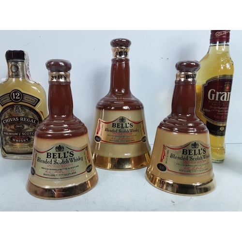 12 - Seven various bottles of whisky consisting of three Bell's, one 18, 75cl, one 20cl & one 37.5cl, bot... 