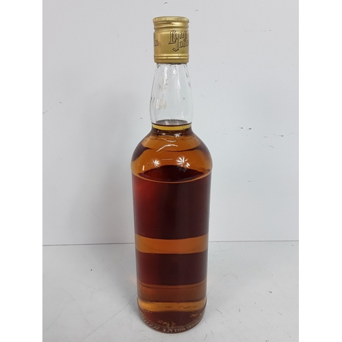 15 - Tubed bottle of Bowmore Legend, 70cl, 40% and a bottle of Long John, 26 2/3 fl.oz, 70 proof