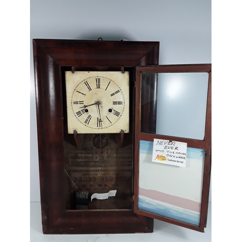 28 - Wooden cased American wall clock, complete