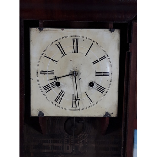 28 - Wooden cased American wall clock, complete