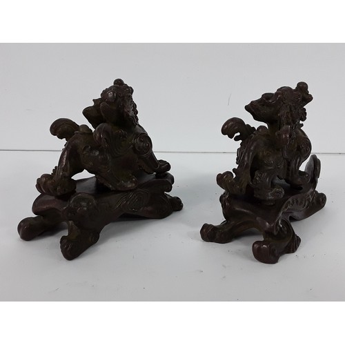 25 - Pr of cast bronze Dogs of Fo on metal bases, 8 x 10 x 5cms