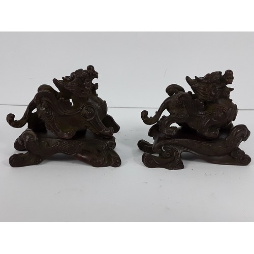 25 - Pr of cast bronze Dogs of Fo on metal bases, 8 x 10 x 5cms