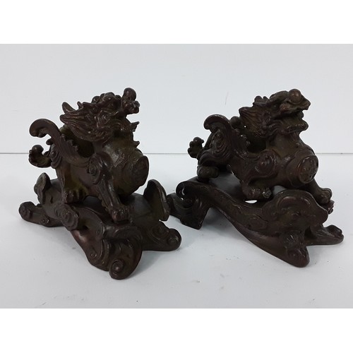 25 - Pr of cast bronze Dogs of Fo on metal bases, 8 x 10 x 5cms