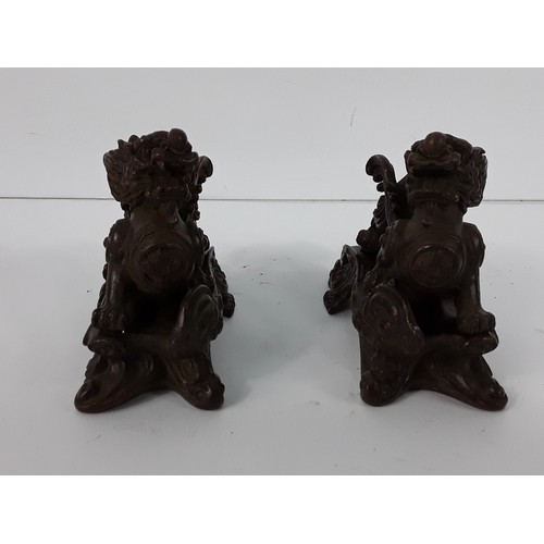25 - Pr of cast bronze Dogs of Fo on metal bases, 8 x 10 x 5cms