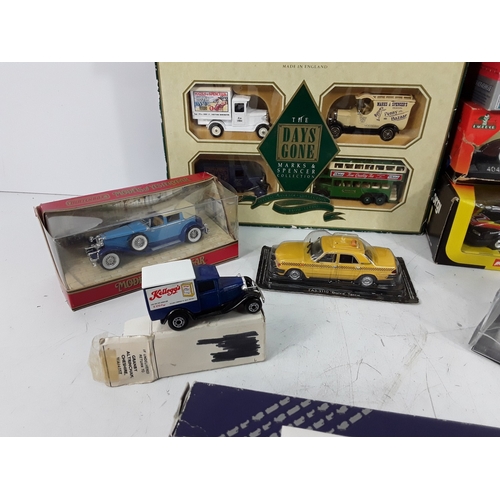 35 - Two boxes of model vehicles