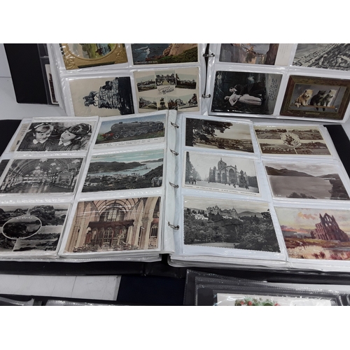 36 - Four albums of postcards