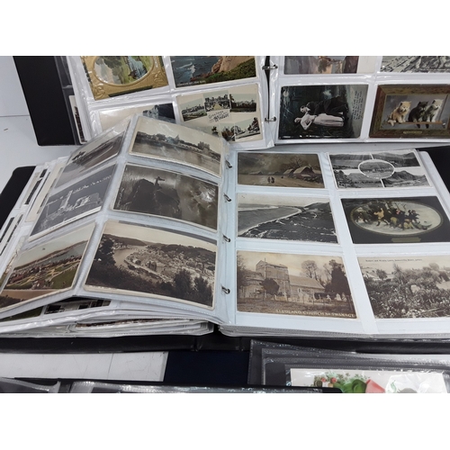 36 - Four albums of postcards