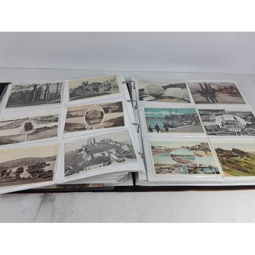 36 - Four albums of postcards